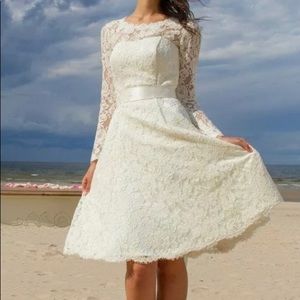 New with tags knee length wedding dress size 16
